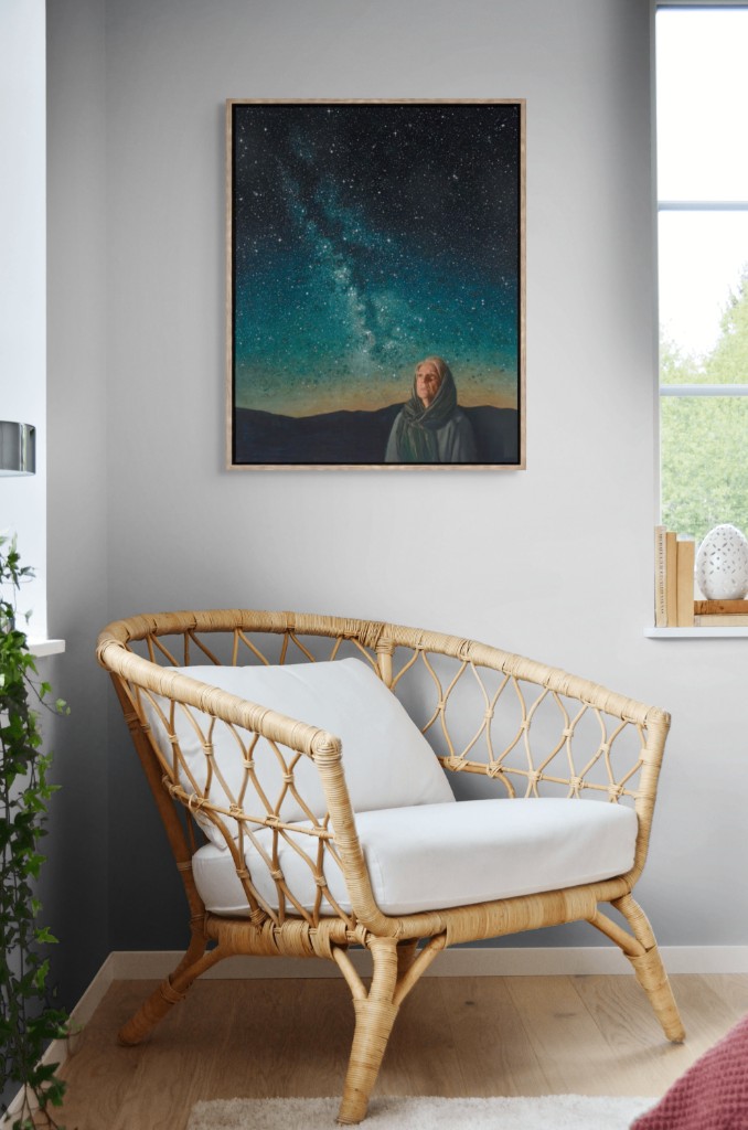 Pondering God's Promise framed above a rattan reading chair