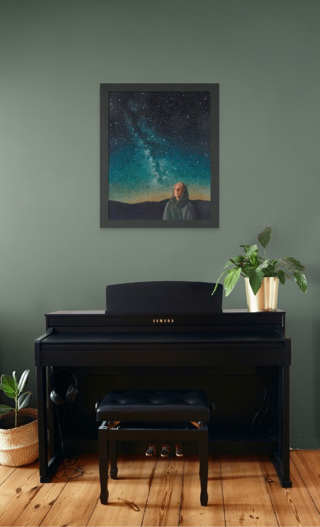 Print hung above a piano on a sage green wall